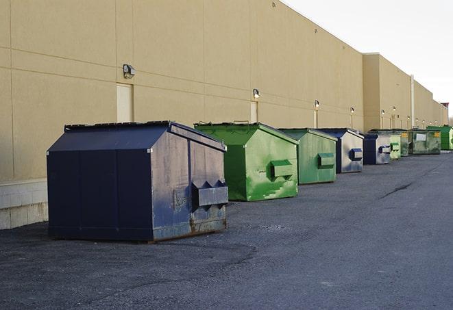 a group of dumpsters lined up along the street ready for use in a large-scale construction project in Cold Springs CA